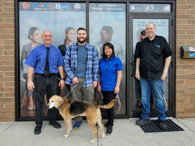 A Laptop Repair Shoppe Calgary team photo in front of the store.