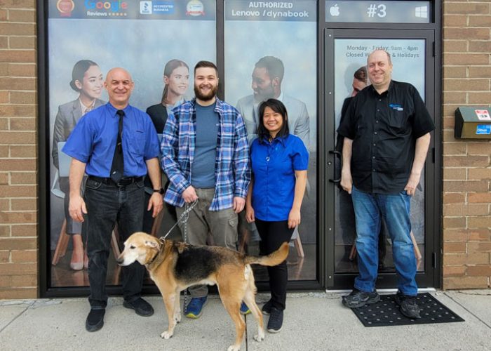 A Laptop Repair Shoppe Calgary team photo in front of the store.